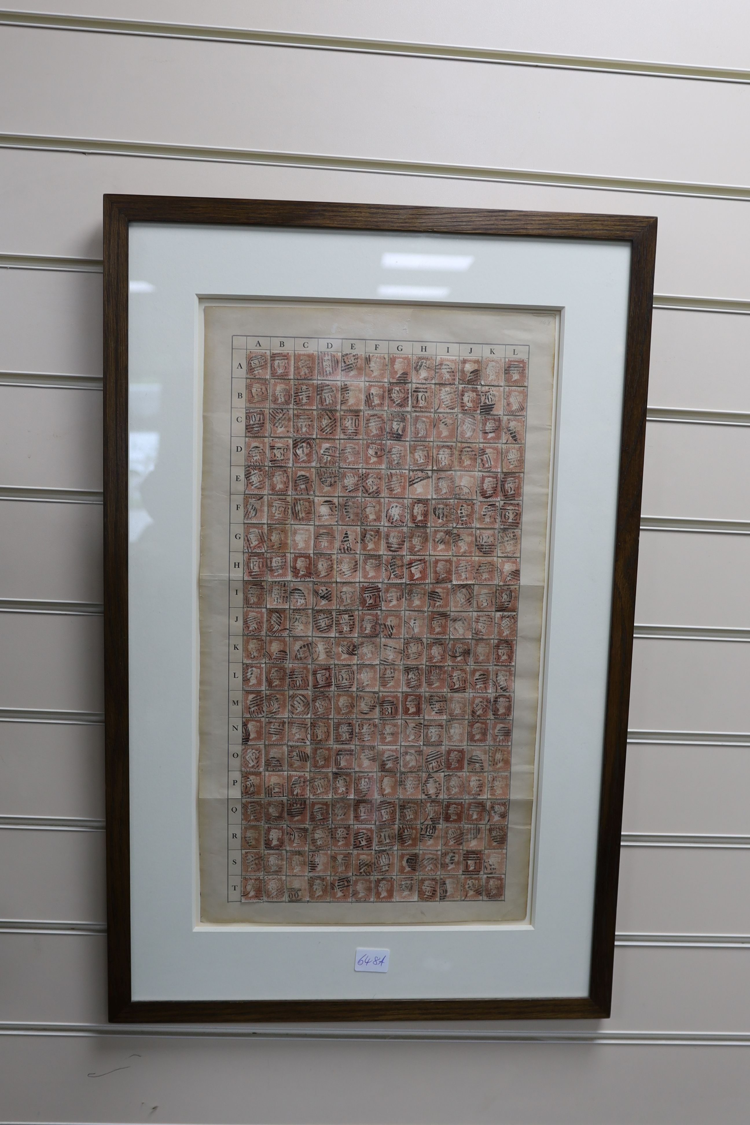 A framed plate of penny reds